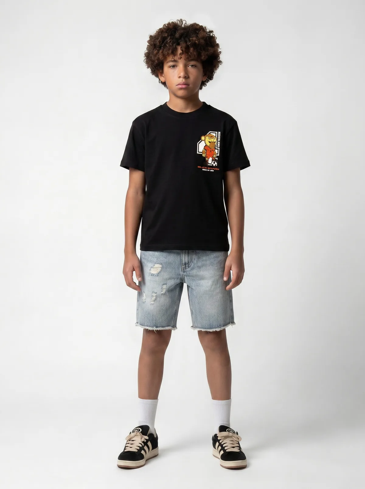 Black Bananas Nederland World Cup mascot soccer chest-print black tee with light distressed denim shorts on AI young model in clean white studio