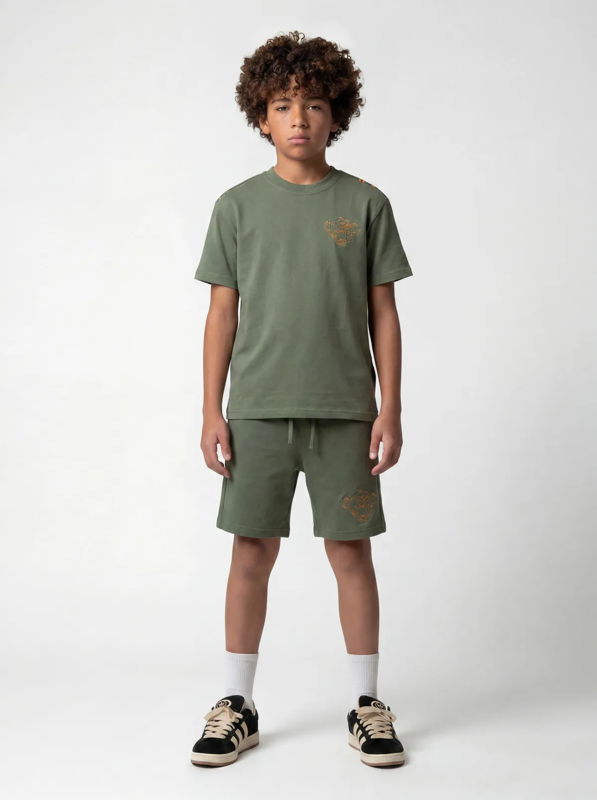 Black Bananas olive green panther-embroidery chest and shoulder-tape tee with matching shorts on AI young model in clean white studio