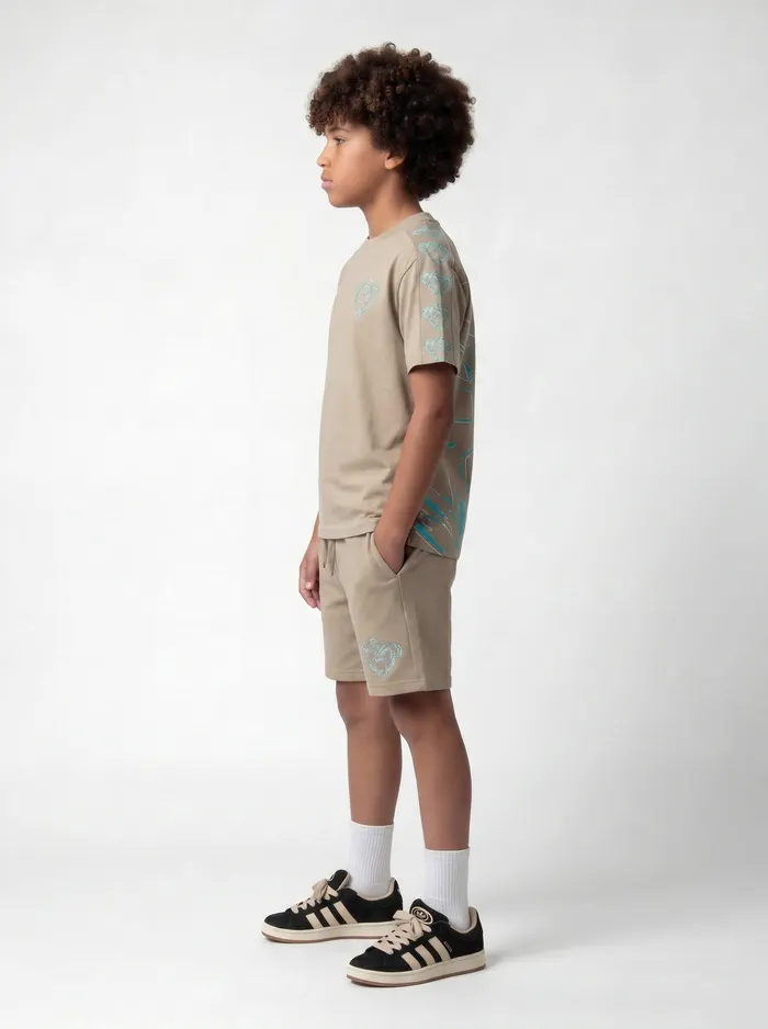 Black Bananas beige panther embroidery twinset alt three-quarter pose on AI young model in clean studio