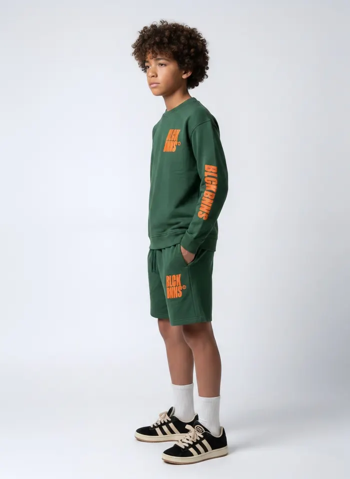 Black Bananas forest green BLCK BNNS orange-print twinset chest detail crop on AI young model