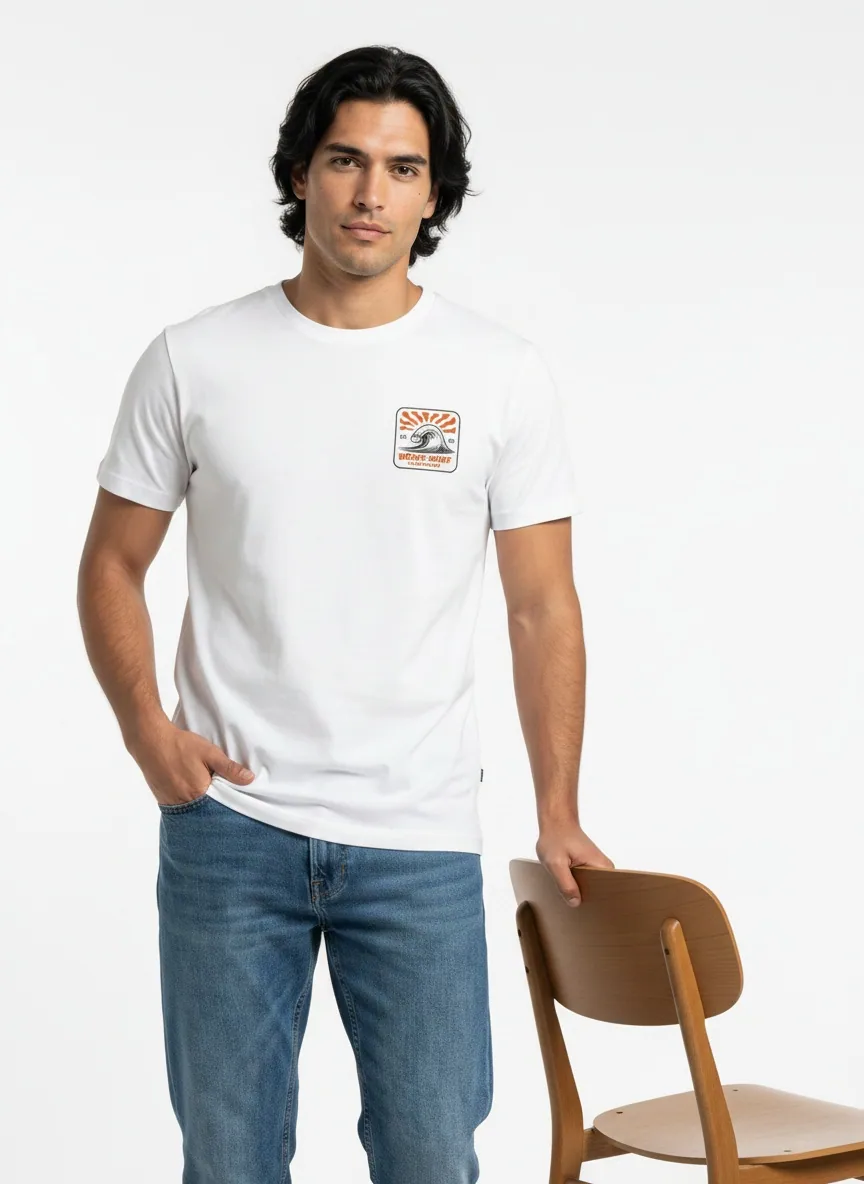 Bōdie Surf Co white tee with rising-sun wave chest patch on AI male model standing in clean white studio