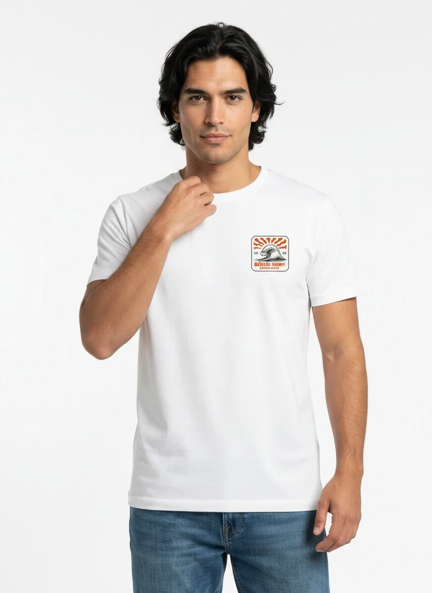 Bōdie Surf Co white tee with rising-sun wave chest patch three-quarter pose on AI male model in clean white studio