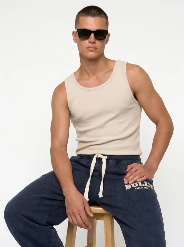 Bully navy acid-wash sweatpant, seated editorial pose