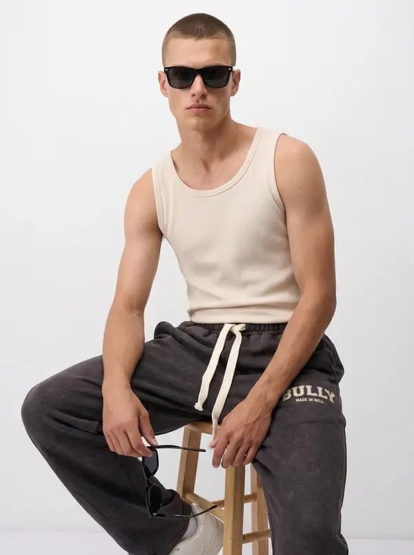 Bully espresso acid-wash sweatpant, seated editorial pose
