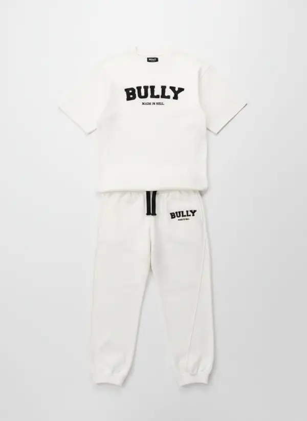 Bully Made In Hell cream tee and pant co-ord shown as a full-look product flat
