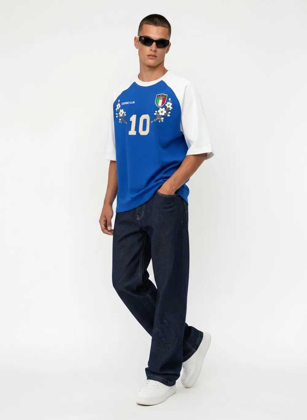 Bully Essence Club raglan tee, walking three-quarter frame with baggy dark denim, on an AI male model