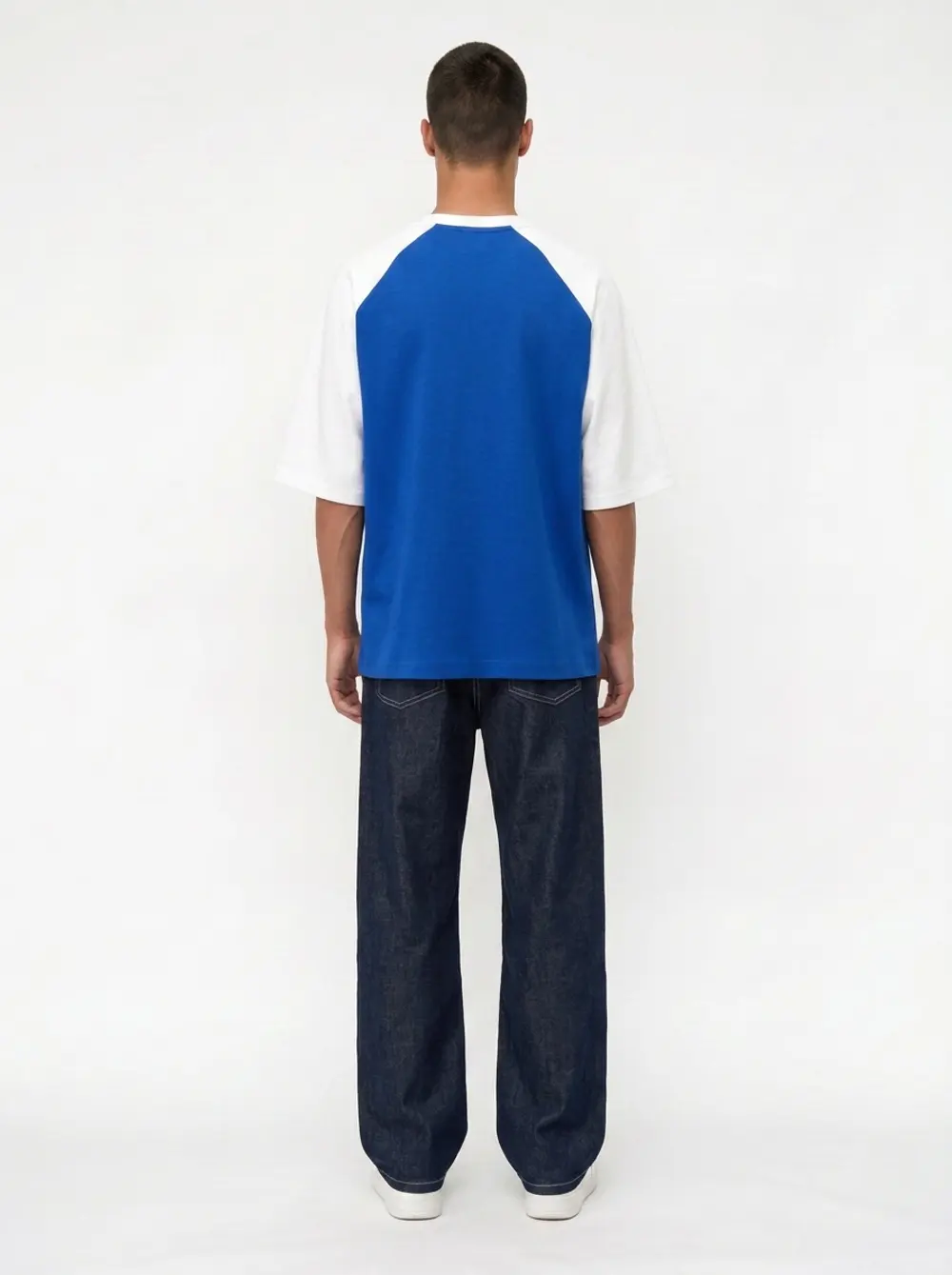 Bully Essence Club raglan tee, full back view with baggy dark denim, on an AI male model