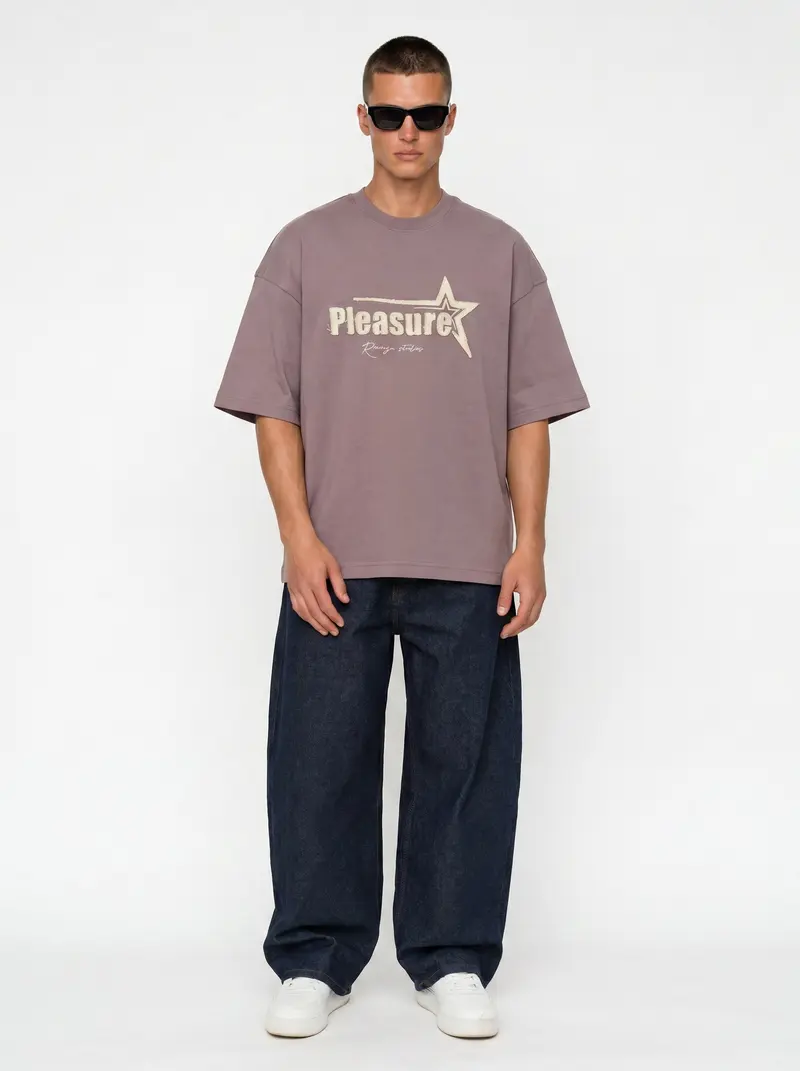 Bully Pleasure star-graphic oversized tee in mauve with indigo baggy denim, on an AI male model