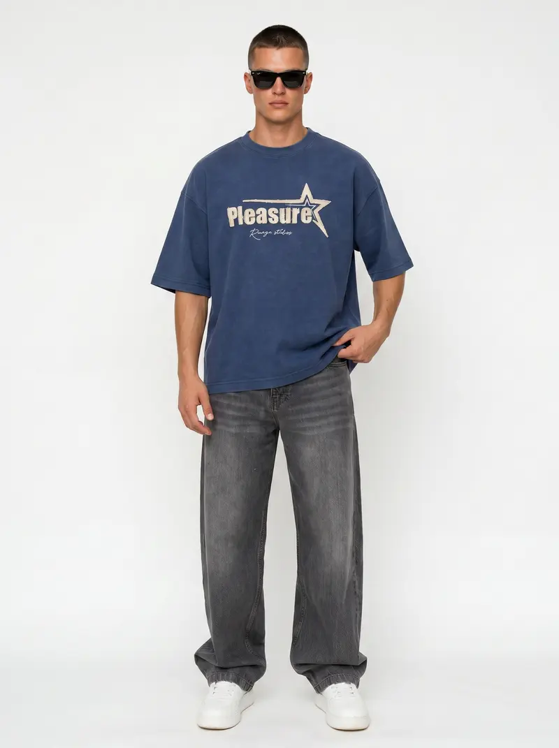 Bully Pleasure star-graphic oversized tee in washed navy with grey denim, on an AI male model
