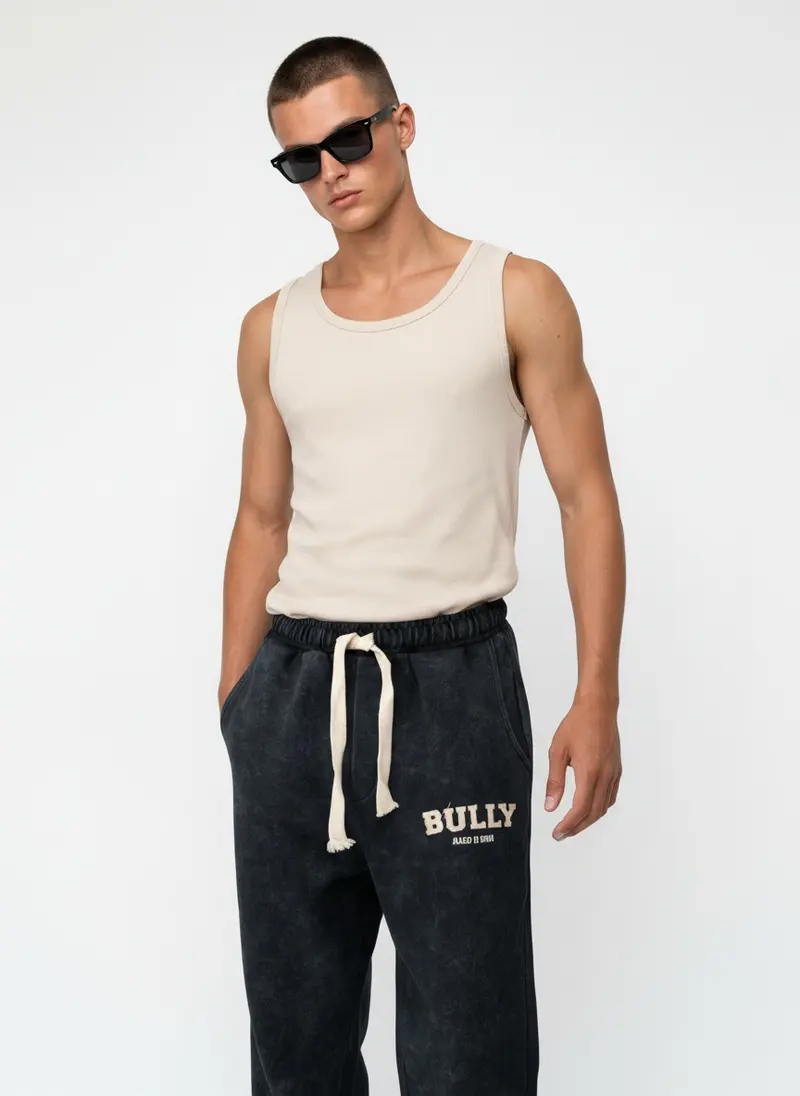 Bully wordmark sweatpant in ink acid wash with a ribbed tank, on an AI male model