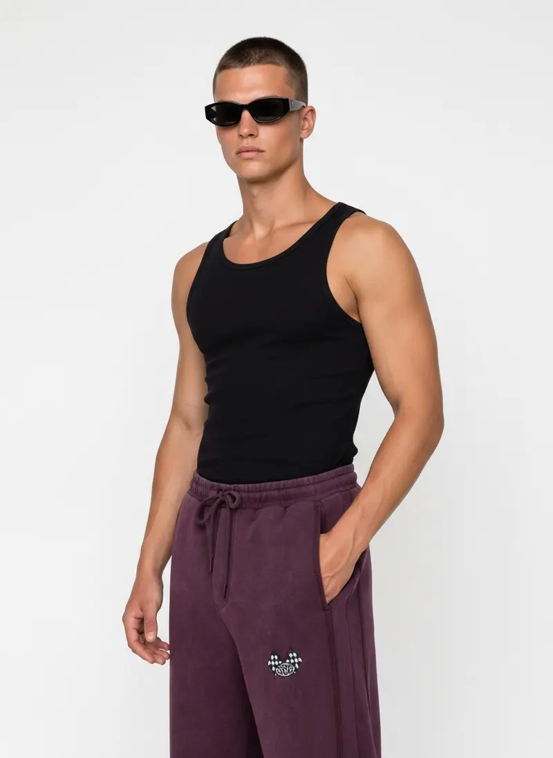 Bully checkered-flag sweatpant in plum wash with a black tank, on an AI male model