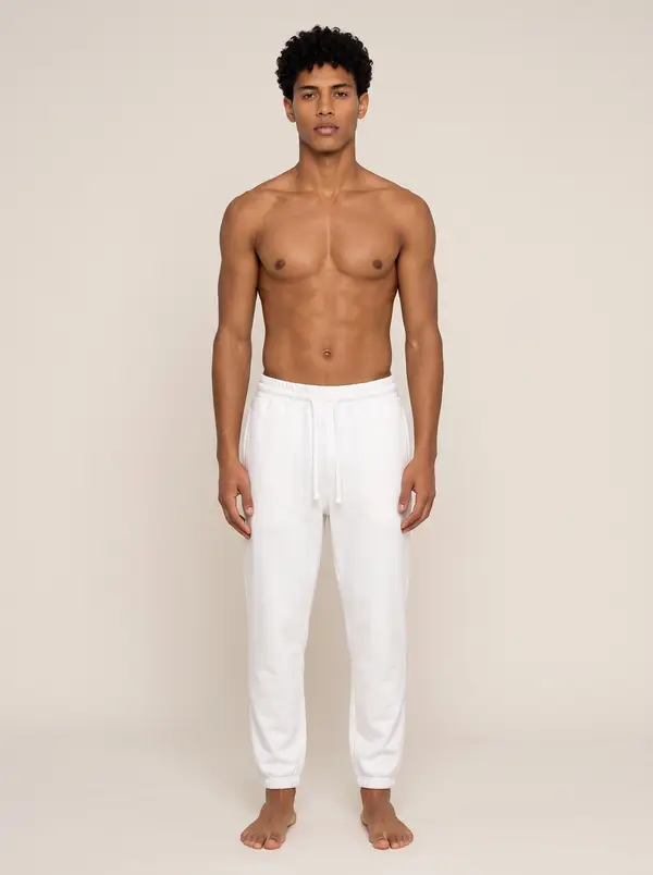 Future Homme ivory jogger, front full length, on the second AI muse in a warm studio