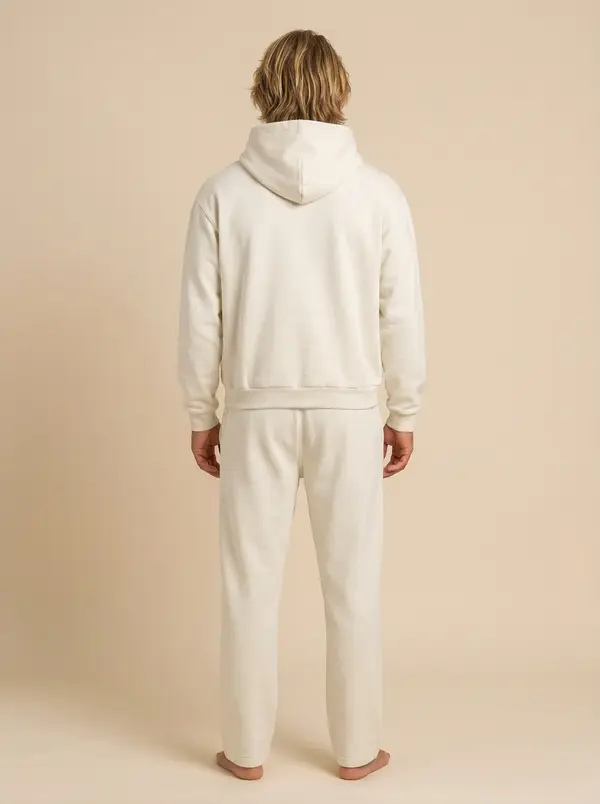Future Homme bone hooded set, back full length with jogger cuff, on an AI male model