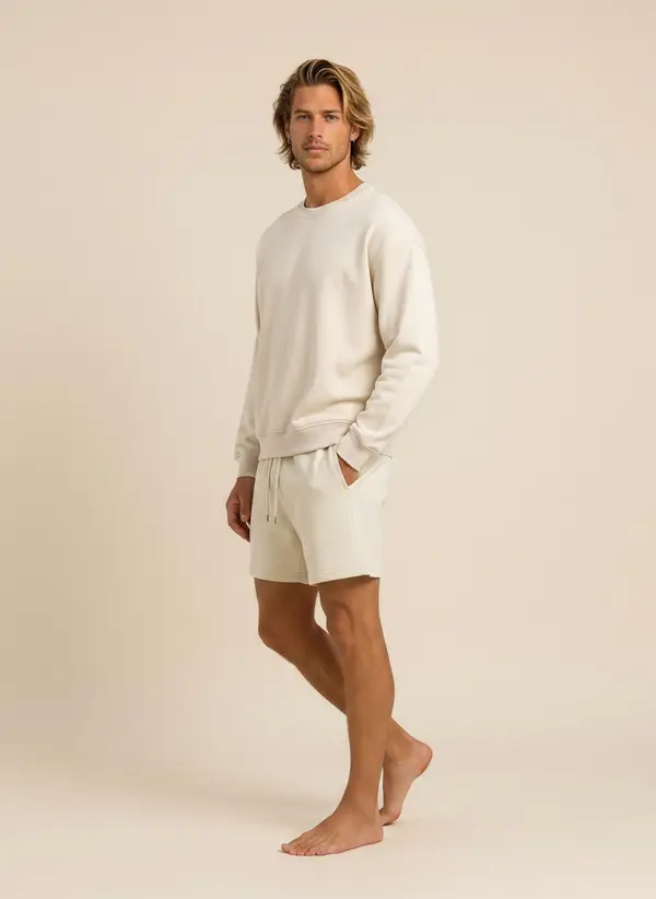 Future Homme cream crew and short set, side profile with hand in pocket, on an AI male model