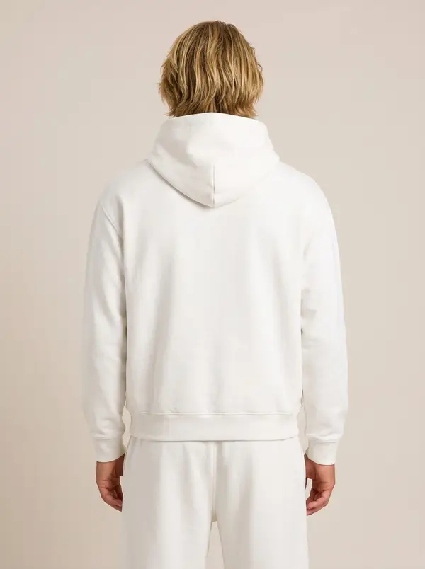 Future Homme white hooded set, back view showing hood and drawcord, on an AI male model