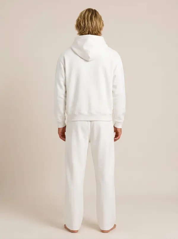 Future Homme white hooded set, back full length, on an AI male model in a bone studio