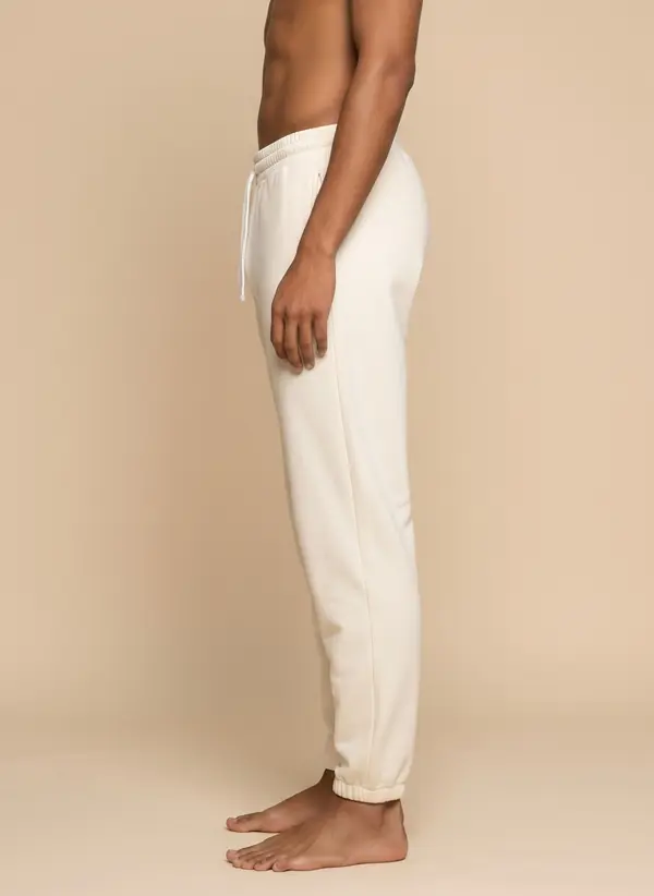 Future Homme cream jogger, side profile full length, on the second AI muse