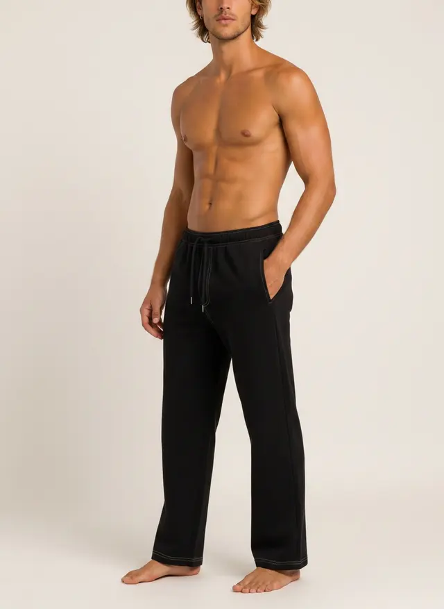 Future Homme black lounge pant, three-quarter turn, full length, on an AI male model in a warm studio