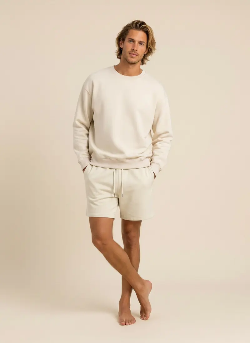 Future Homme cream crew sweatshirt and matching short set on an AI male model, hands in pockets