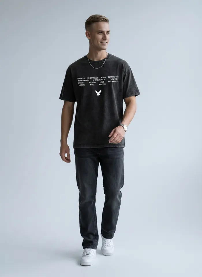Godzeal acid wash scripture tee side profile pose on AI male model in clean American studio