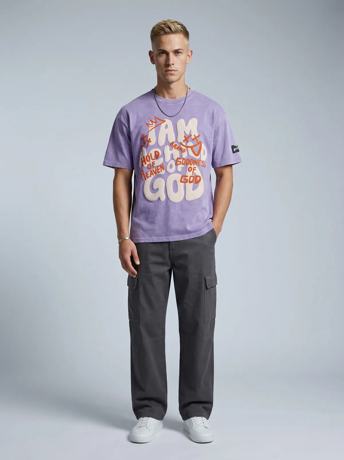 Godzeal I AM A CHILD OF GOD lilac bubble-graphic tee on AI male model with blonde hair and cargo pants in clean American studio