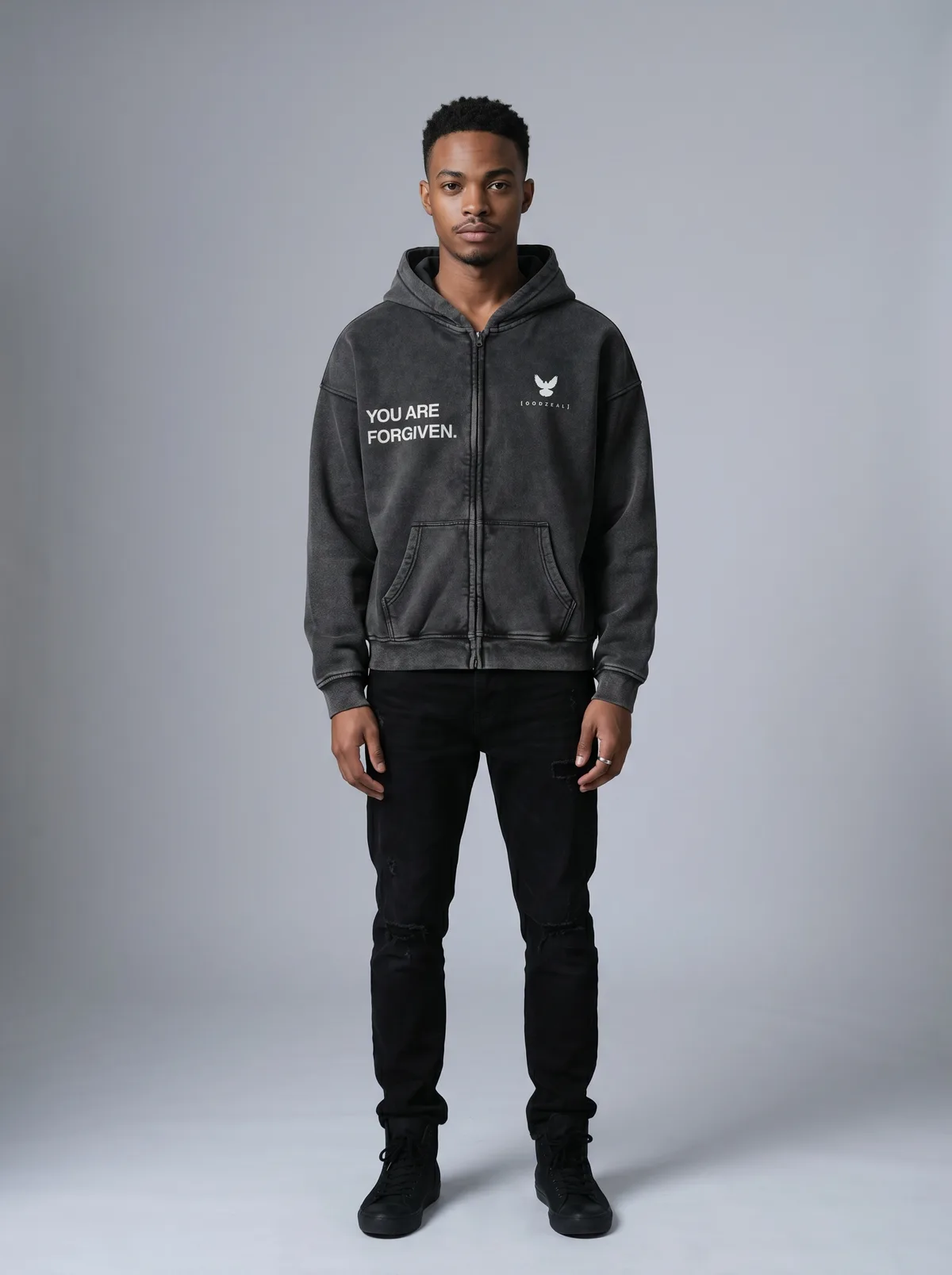 Godzeal YOU ARE FORGIVEN grey acid wash zip-up hoodie with dove logo on AI male model with short curls in clean American studio