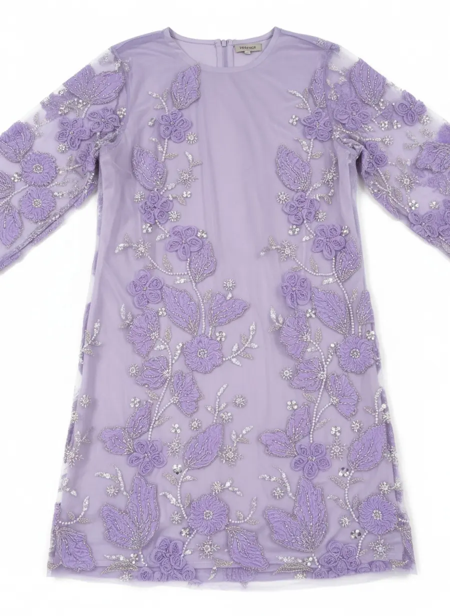 Modest Valoria lilac embroidered overlayer detail frame showing appliqué placement across the front panel and sleeves