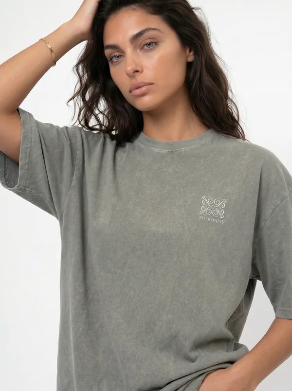 MODA AI unified catalog shot — olive acid-wash oversized tee on model, cohesive catalog look