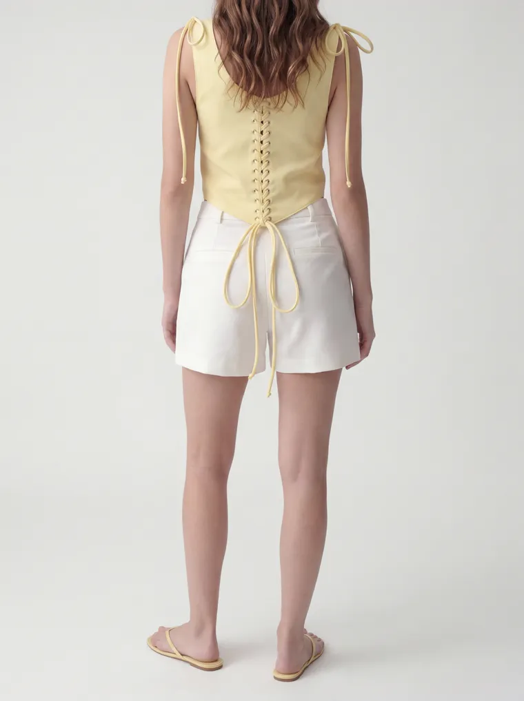 MODA AI catalog output — the vest top in butter yellow, side profile
