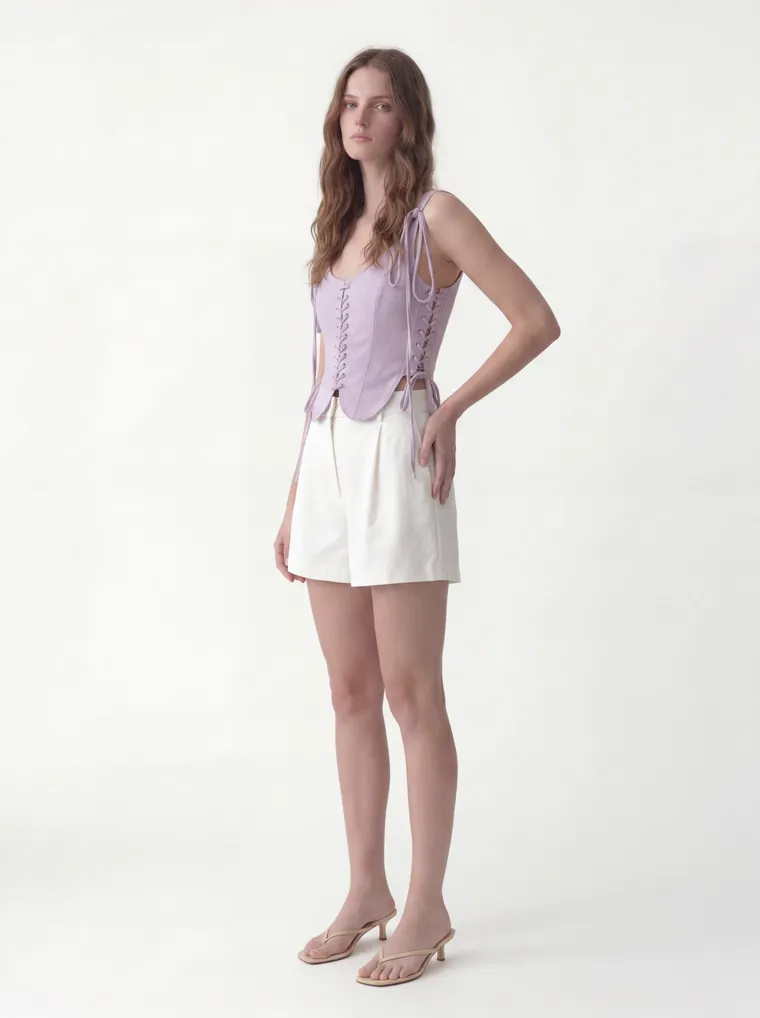 MODA AI catalog output — the vest top in lilac, three-quarter angle on the shared model