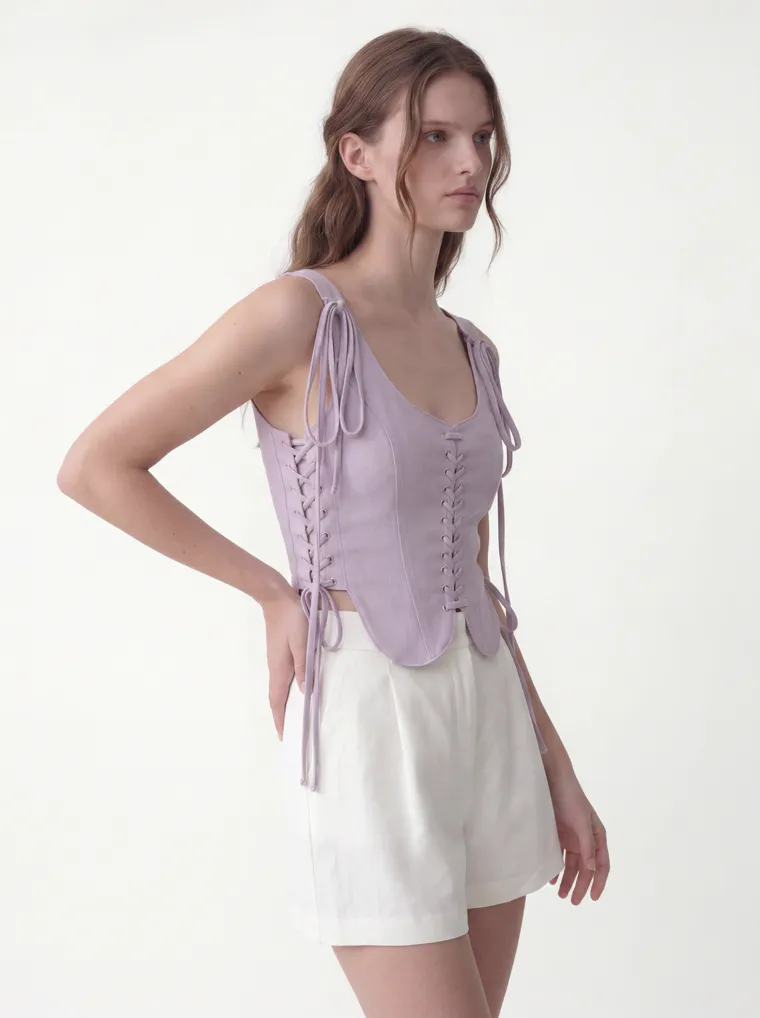 MODA AI catalog output — the vest top in lilac, seated