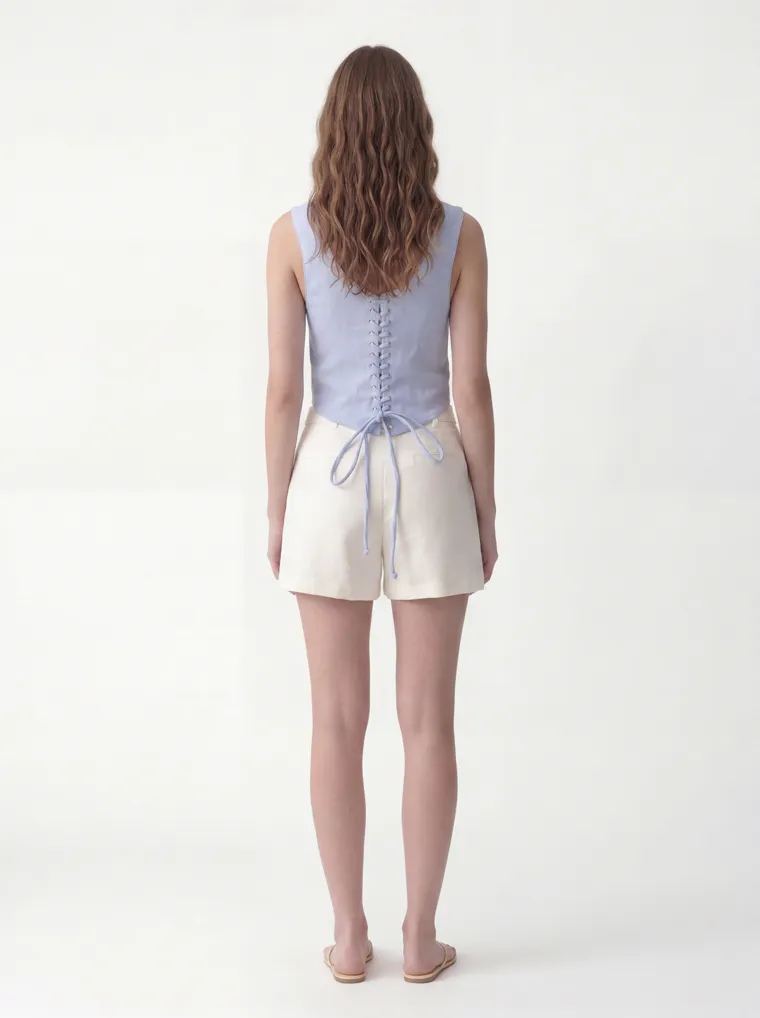 MODA AI catalog output — the vest top in powder blue, three-quarter angle