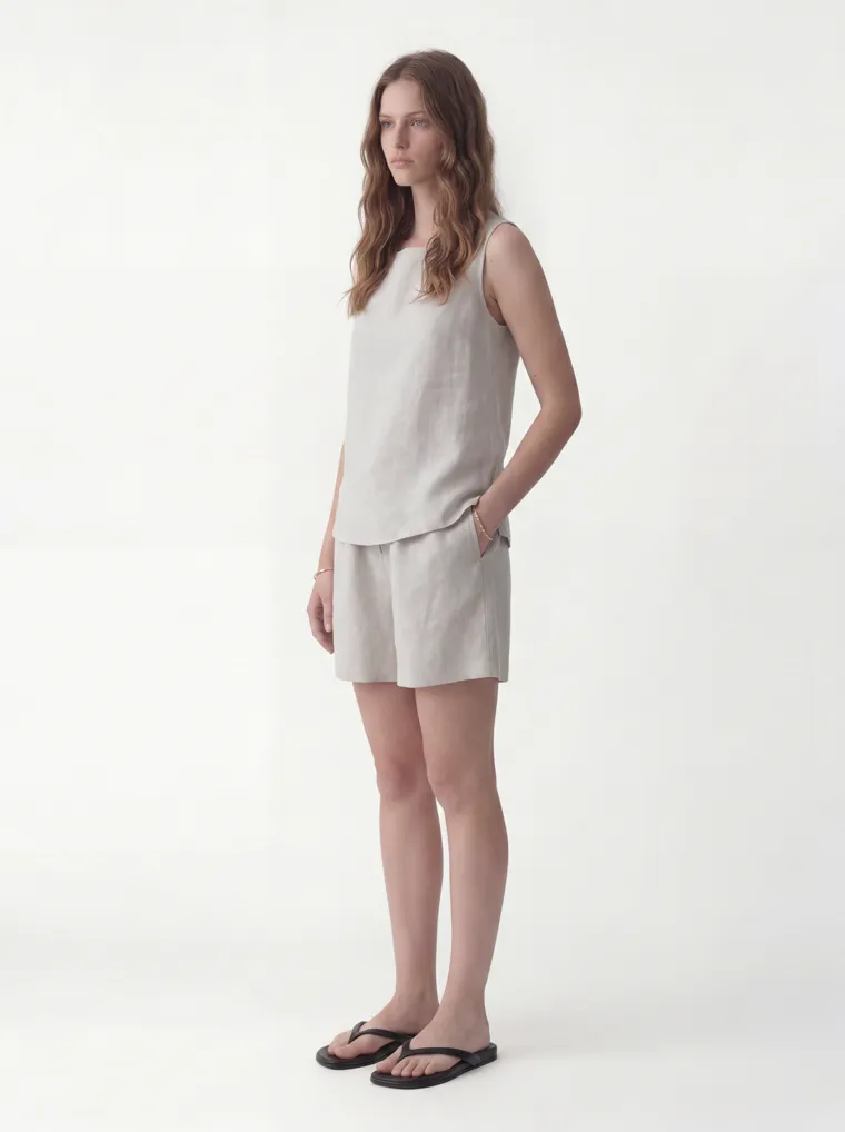 MODA AI catalog output — the linen set in oatmeal, three-quarter front, same model and studio