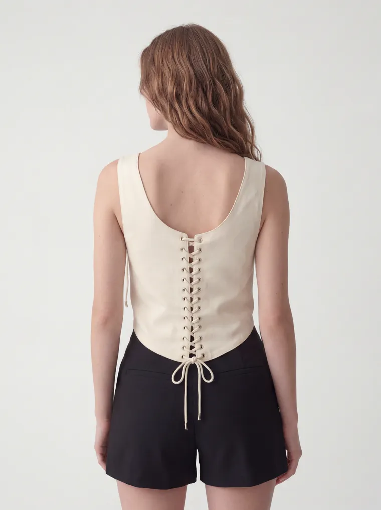 MODA AI catalog output — cream vest top, back showing the full lace-up
