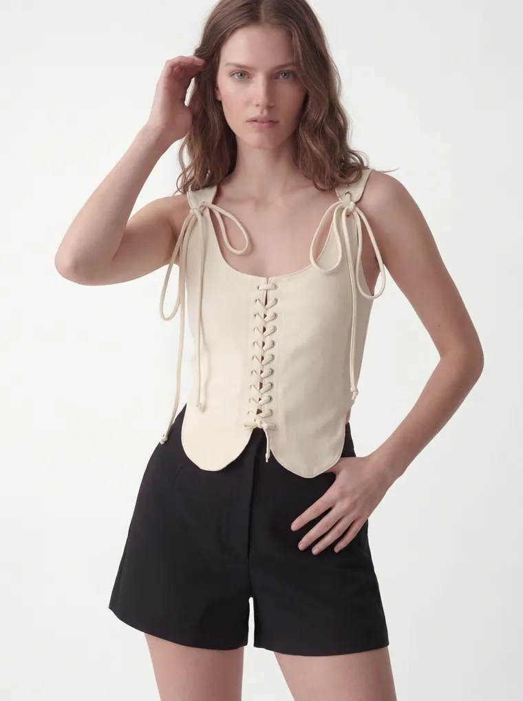 MODA AI catalog output — cream vest top, three-quarter detail crop