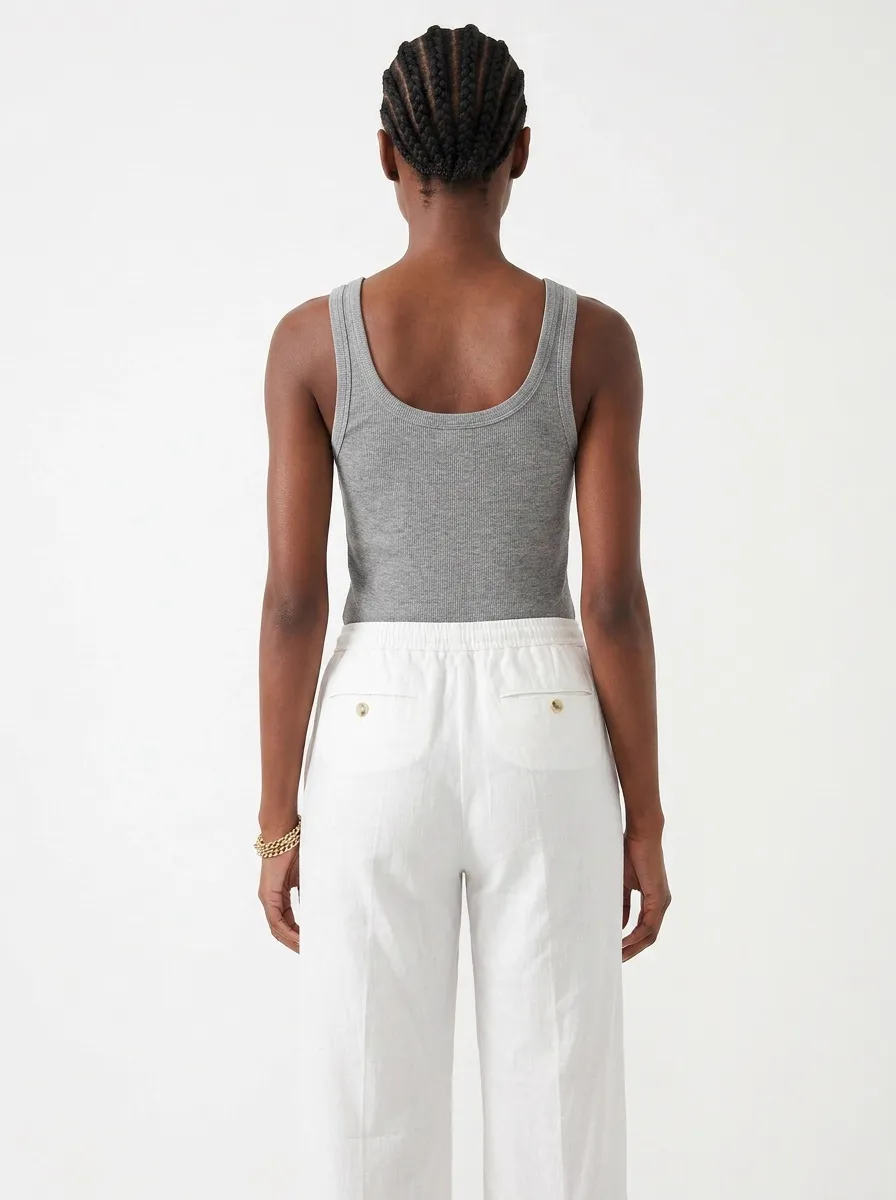 MODA AI catalog output — Black model back view in gray tank and white linen pants showing the rear silhouette and pocket detail