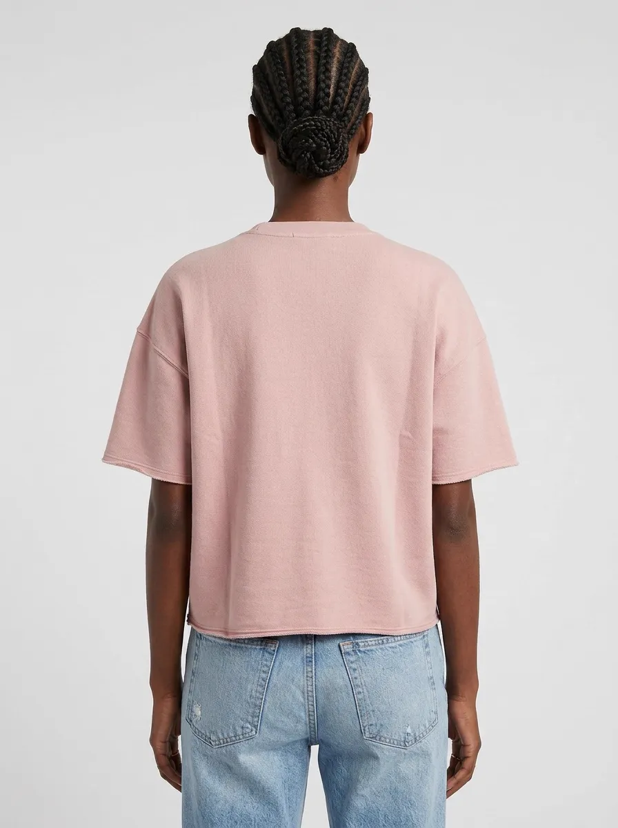 MODA AI catalog output — Black model back view in pink boxy tee and mom jeans, showing the tee's rear silhouette