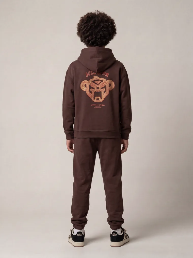 A chocolate brown kids hoodie and jogger set with a tonal animal graphic. FW26 look 20, Tonal Co-ord in Chocolate, frame 3 of 5
