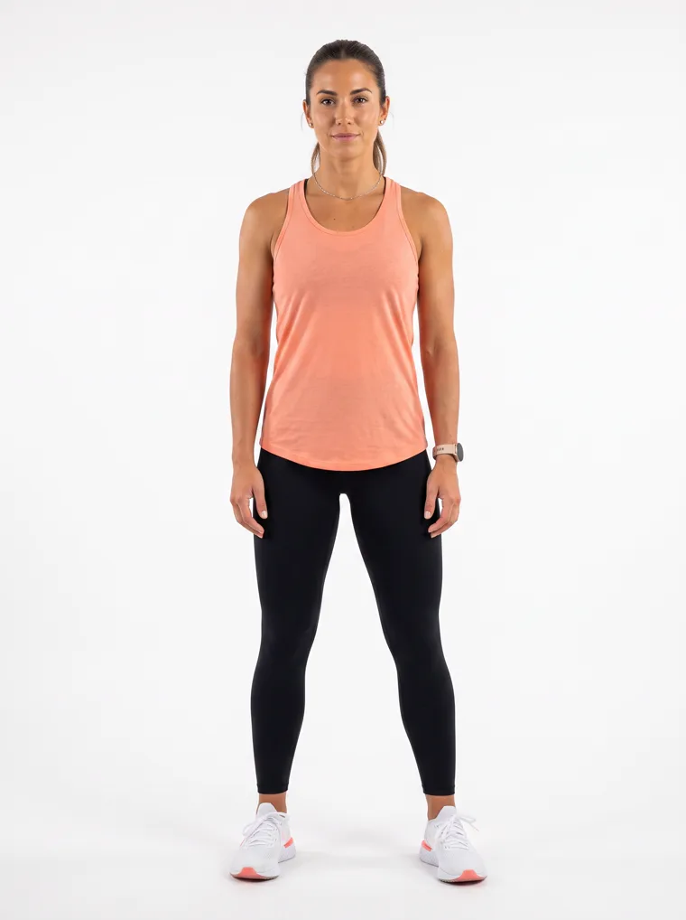 A peach racerback vest with full length black leggings. FW26 look 17, Soft Sport in Peach, frame 2 of 5