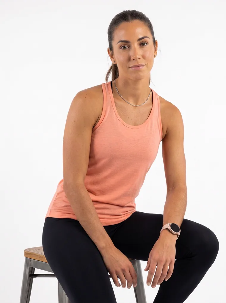 A peach racerback vest with full length black leggings. FW26 look 17, Soft Sport in Peach, frame 3 of 5