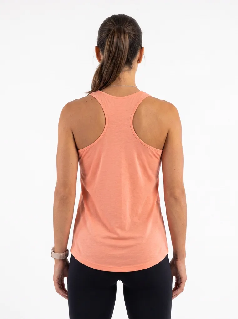 A peach racerback vest with full length black leggings. FW26 look 17, Soft Sport in Peach, frame 5 of 5