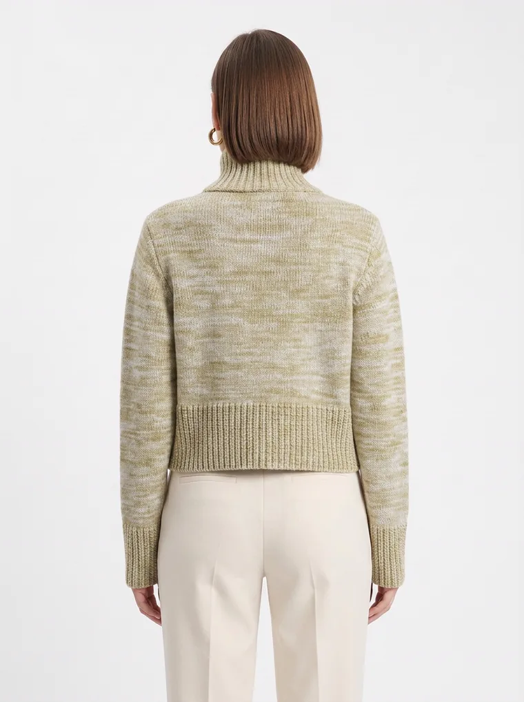 A marled sage green roll neck knit with cream tailored trousers. FW26 look 09, Soft Knit in Sage, frame 5 of 5