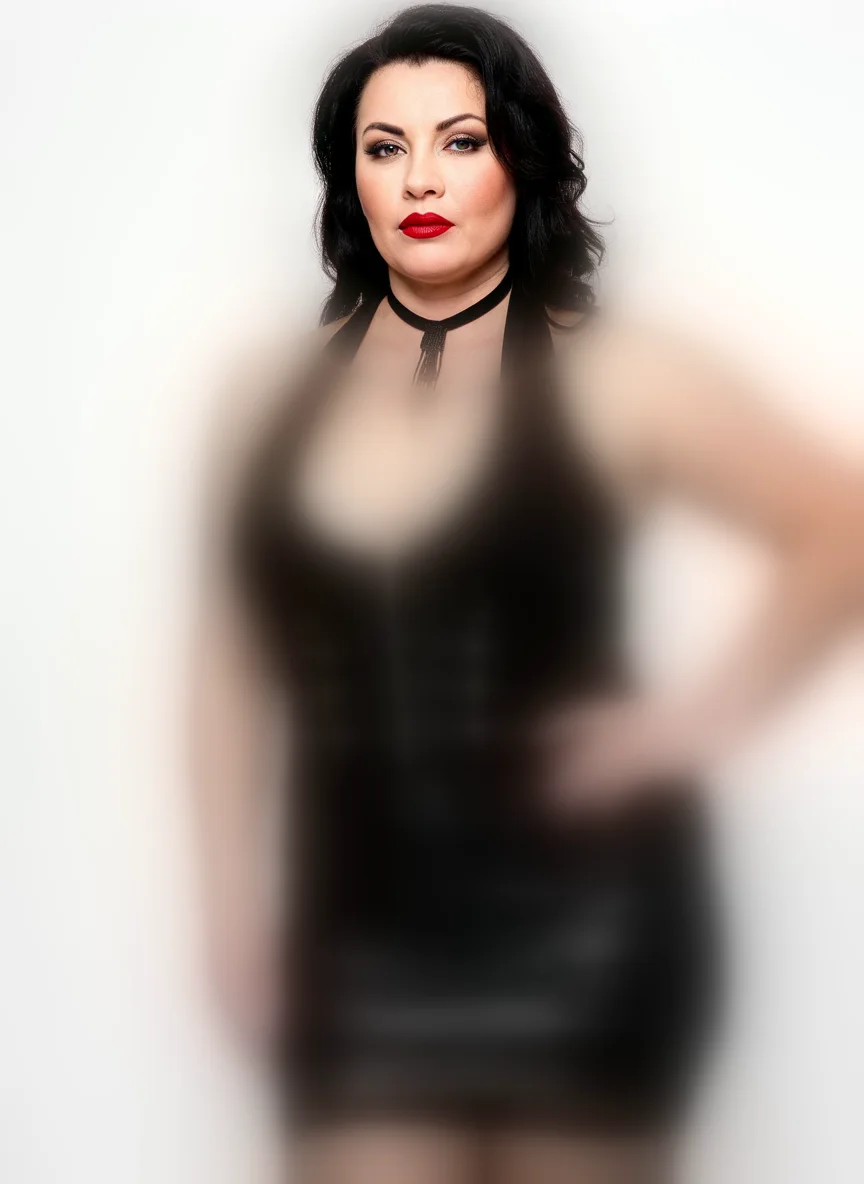 A plus-size AI lingerie model in her late forties with dark hair, red lipstick and a beaded choker, her face in focus and her black corset and wet-look outfit softly blurred