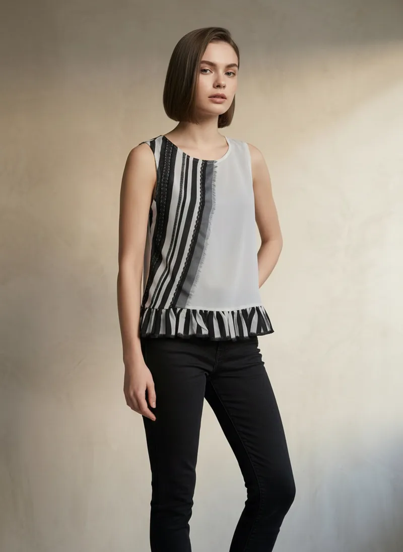 MODA AI output — model standing front in the striped embroidered top with black trousers
