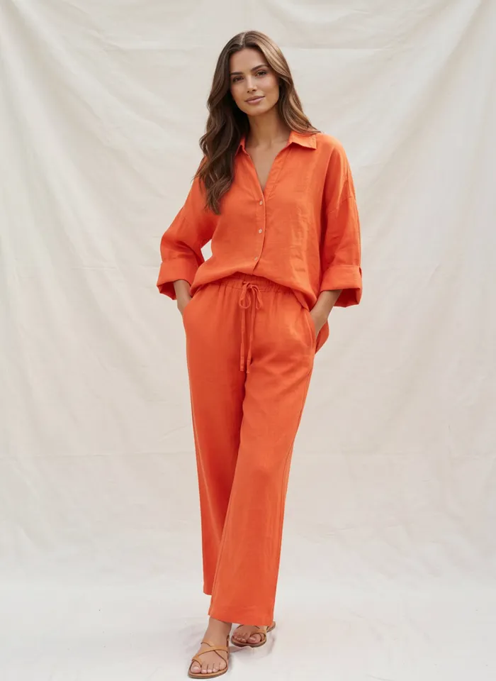 MODA AI on-model output — the orange linen co-ord set on a model, additional catalog angle