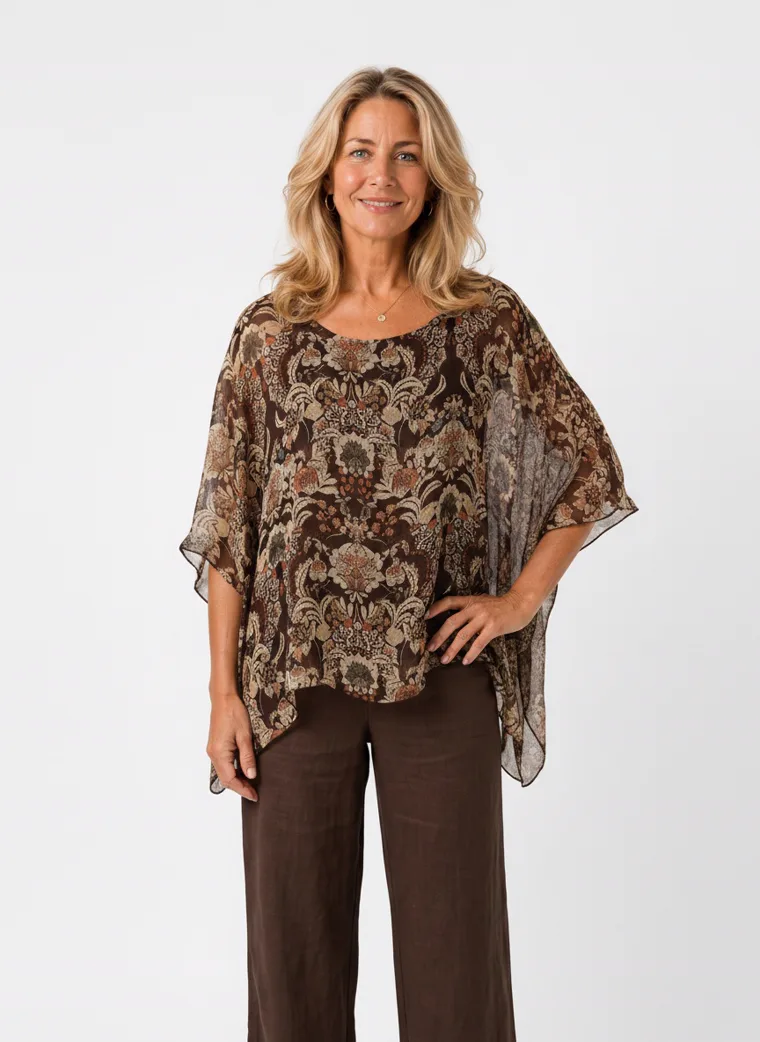 MODA AI on-model output — the paisley kaftan top styled with brown wide-leg trousers, additional catalog angle, generated from a hanger shot in the same clean studio as the rest of the collection