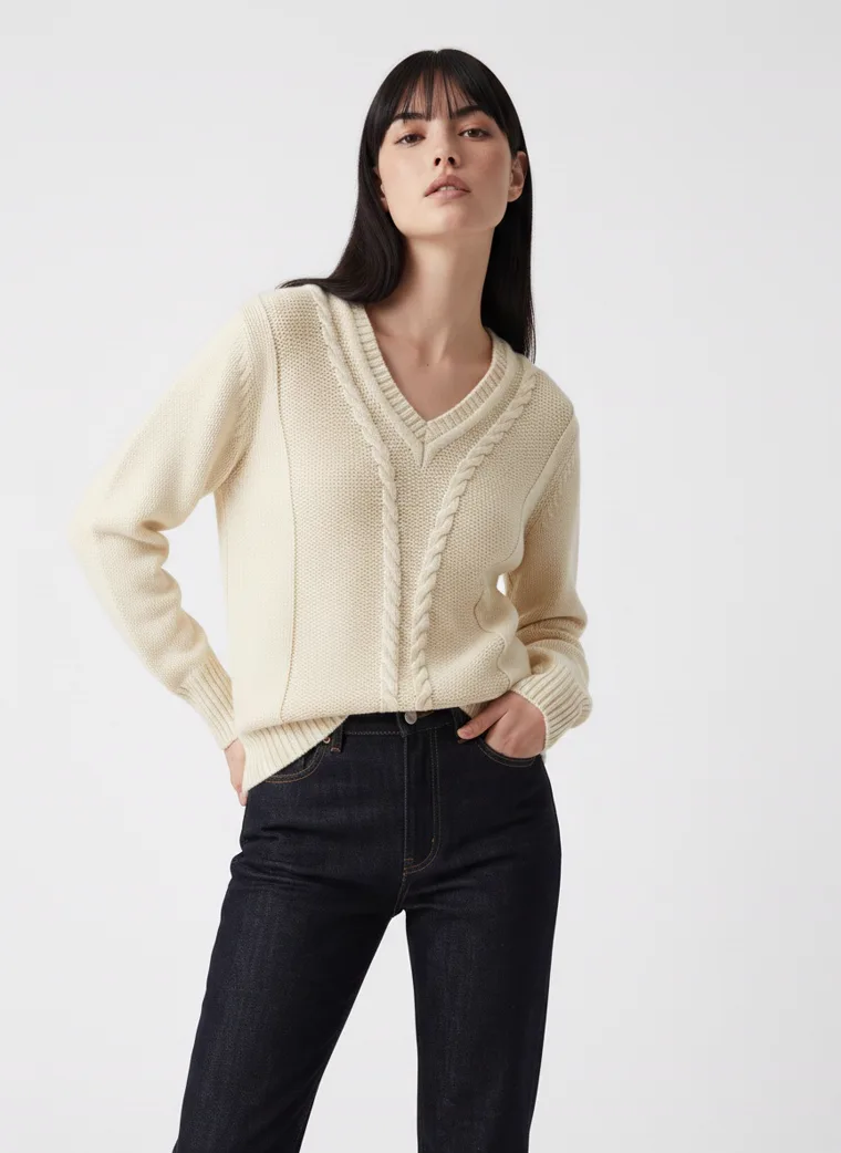 MODA AI output — the cable-knit jumper, turned three-quarter pose showing the sleeve and side seam