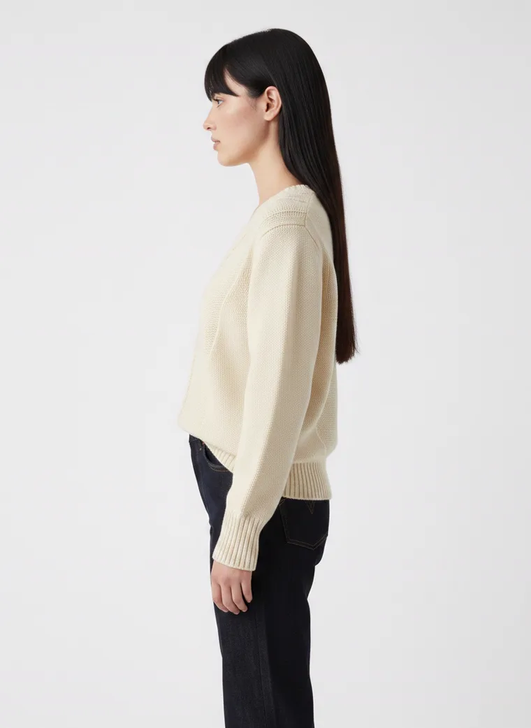 MODA AI output — the cable-knit jumper in side profile, showing the drop shoulder and sleeve length