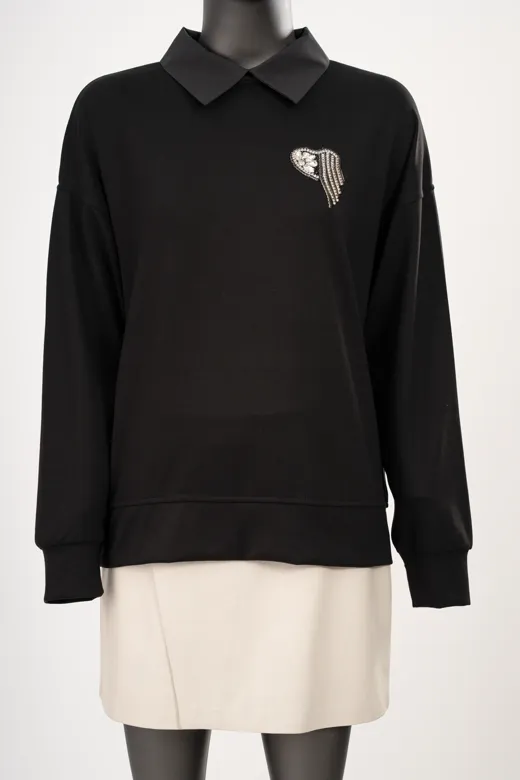 The starting photo for the black and cream collared sweater and pleated skirt: the sweater and skirt on a mannequin