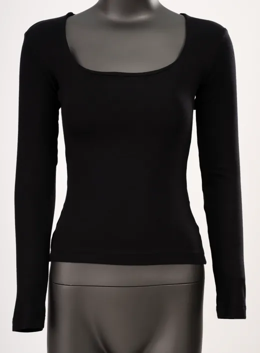 The starting photo for the black scoop-neck long-sleeve top: the black top on a mannequin, the photo behind the studio set
